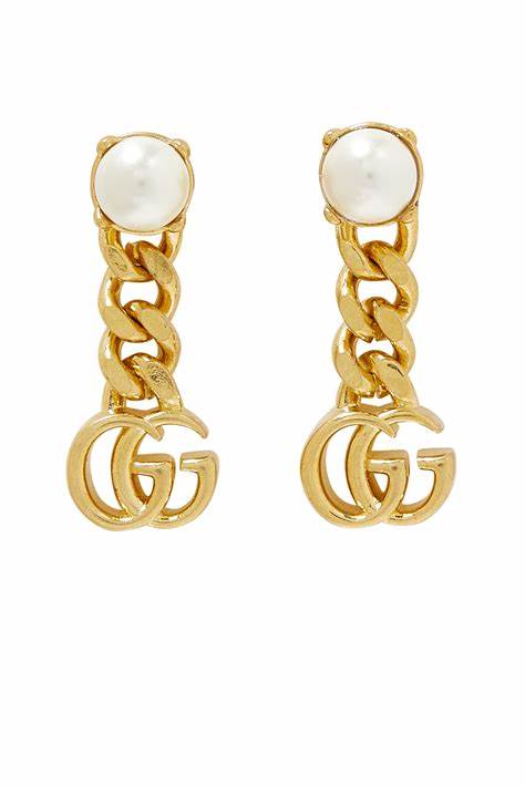 GUCCI' letter hoop earrings in gold-toned | GUCCI® US